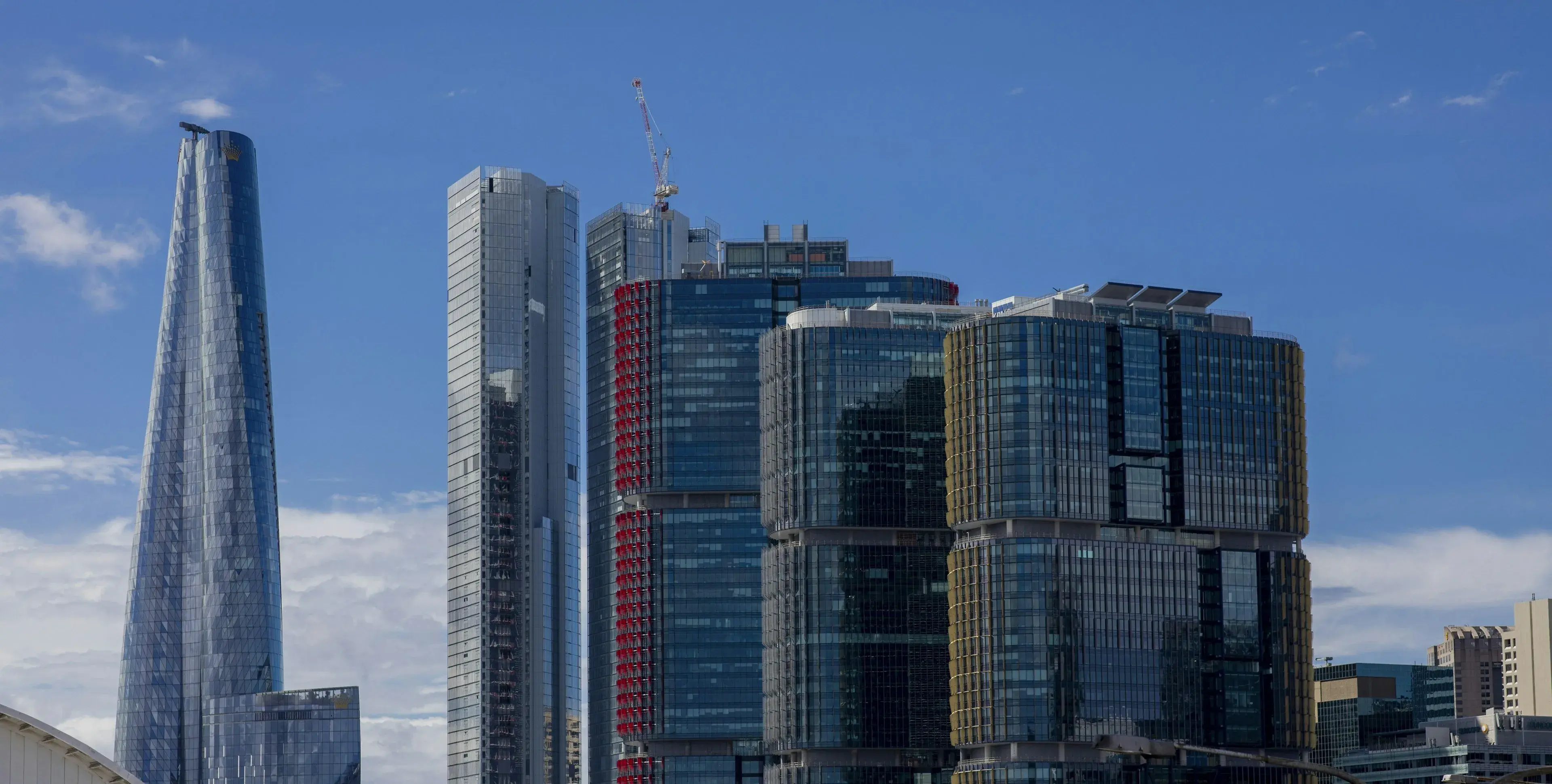 Barangaroo towers in Sydney against a bright blue sky