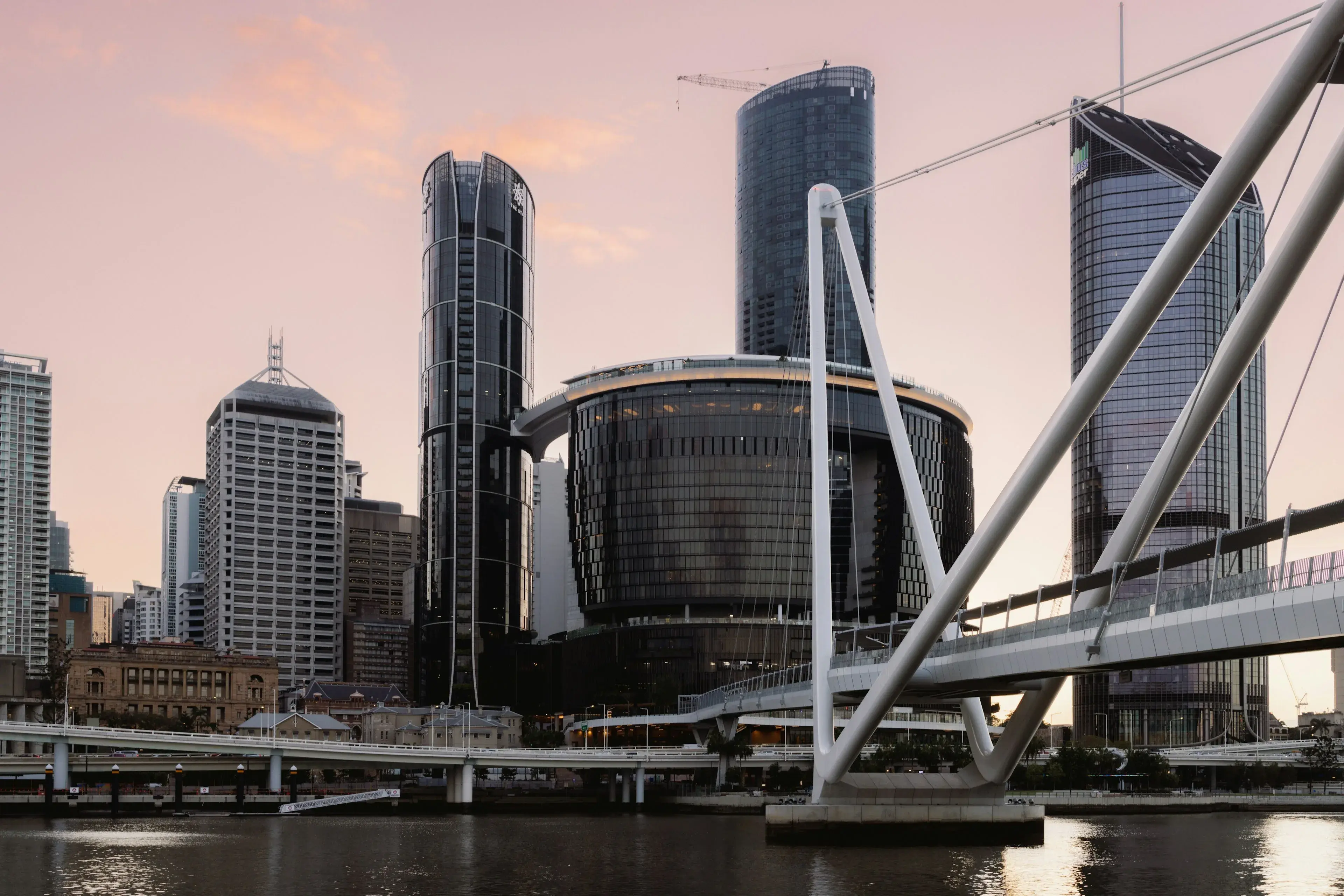 Brisbane city towers and a footbridge across the Brisbane River