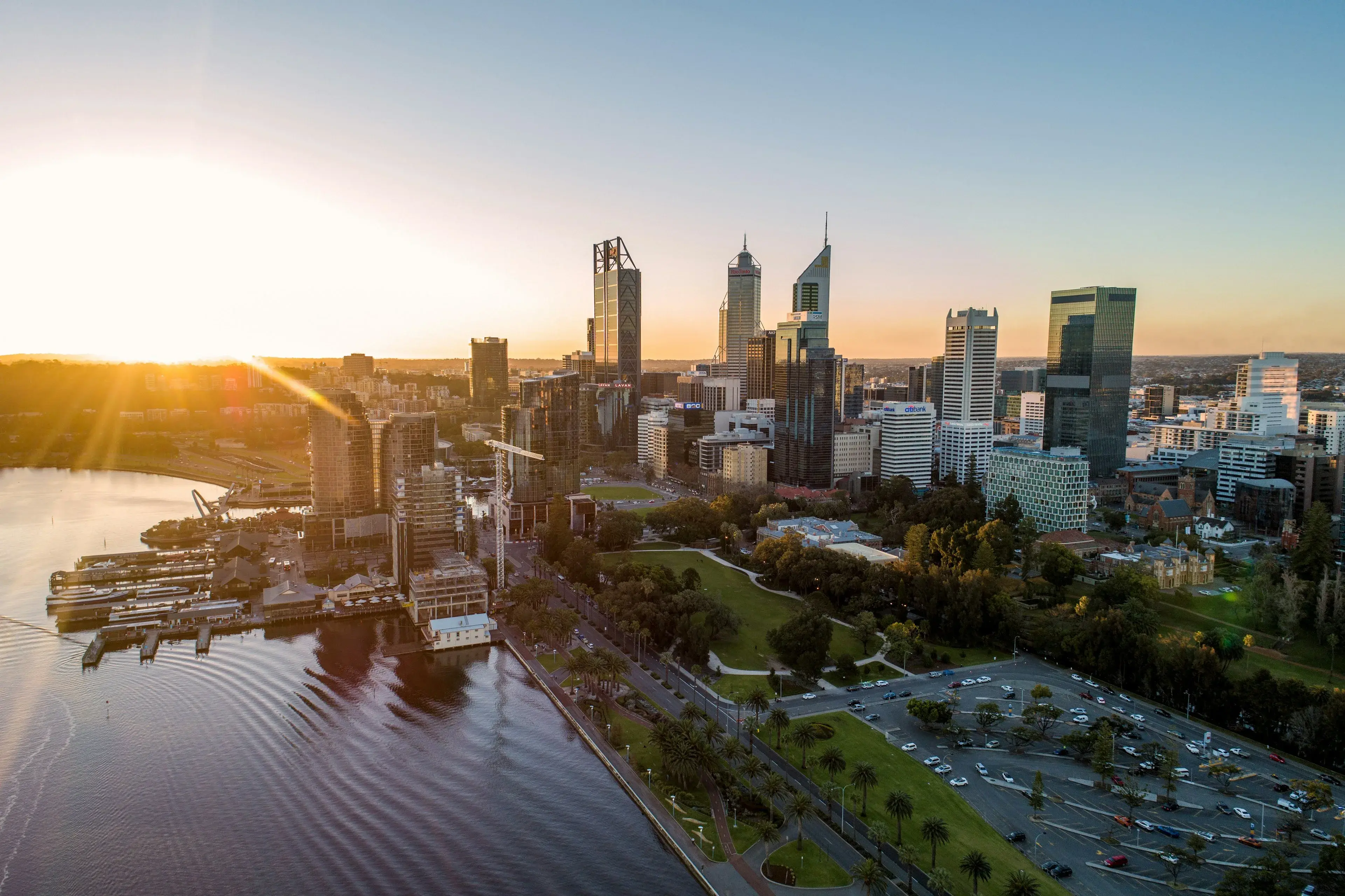 Perth city towers beside the Swan River at sunrise